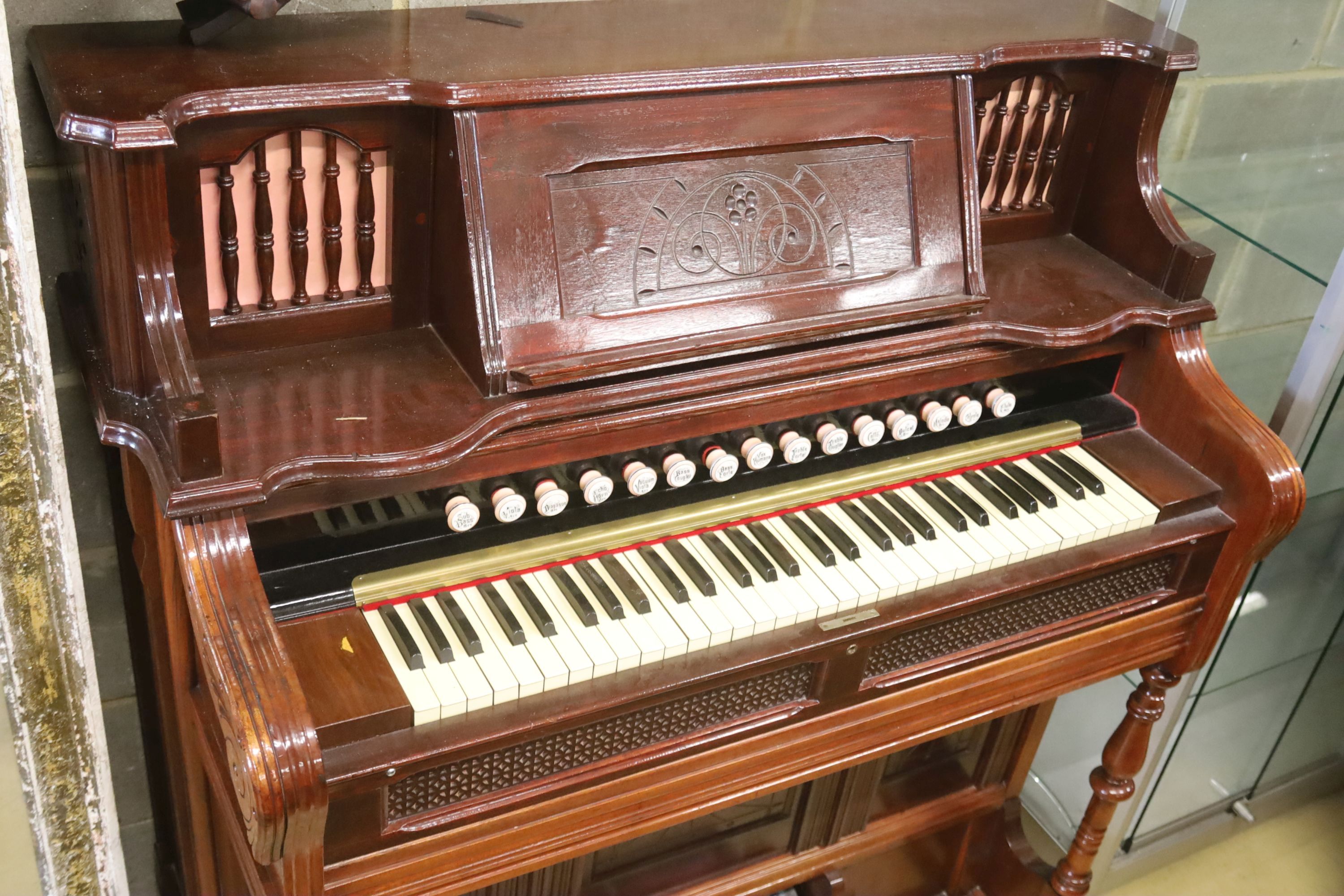 A late Victorian mahogany harmonium, width 120cm, depth 60cm, height 130cm